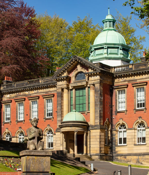 Photo of the entrance to redhills, the green dome is visible above.